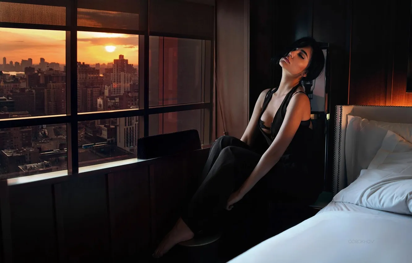 Photo wallpaper girl, sunset, the city, pose, hands, brunette, window, closed eyes