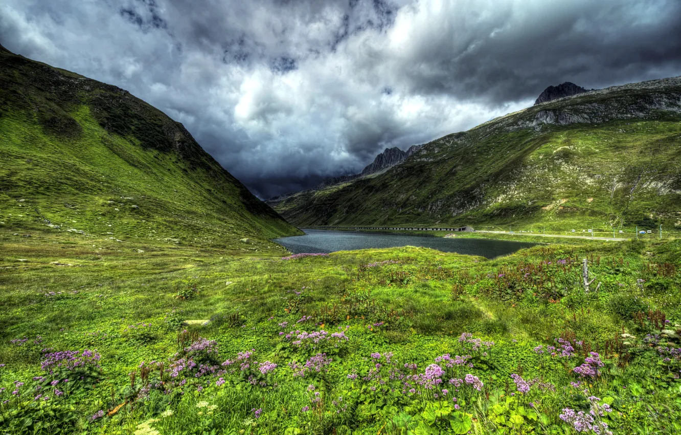 Photo wallpaper road, grass, clouds, flowers, mountains, lake, Switzerland, slope