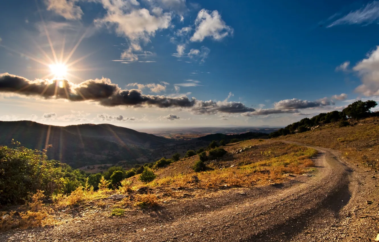 Photo wallpaper road, the sun, clouds, mountains