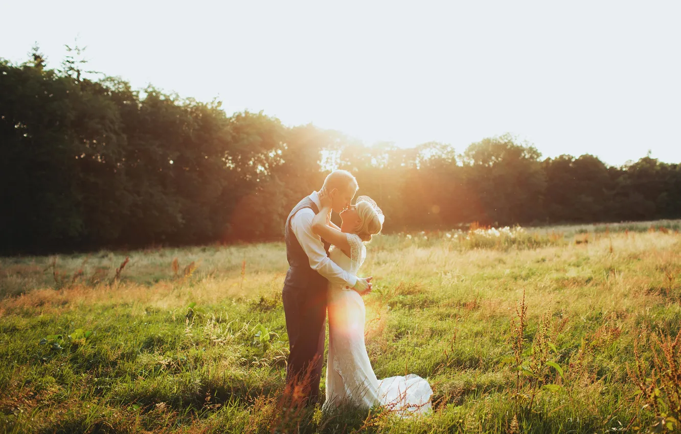Photo wallpaper field, grass, girl, the sun, light, blonde, guy, the bride