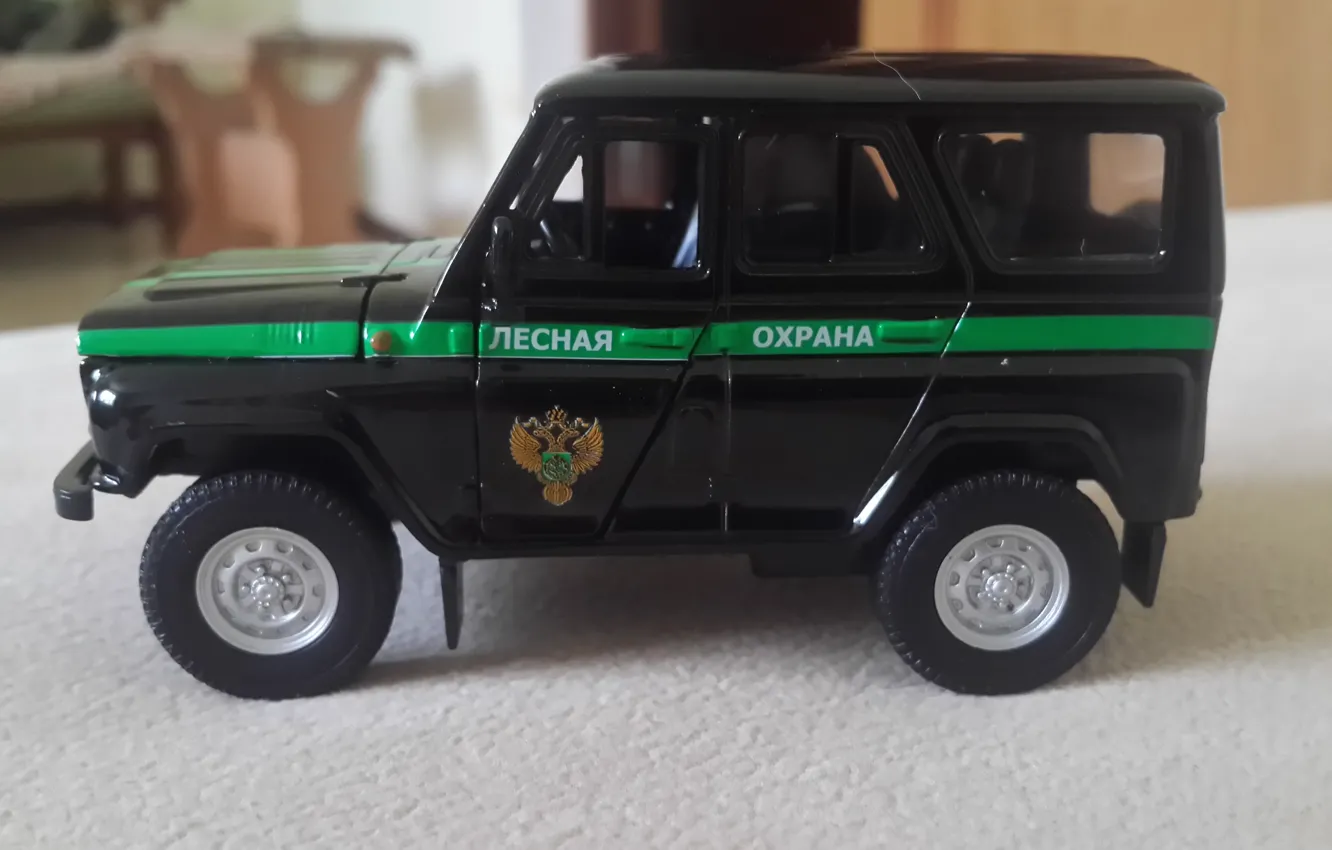 Photo wallpaper UAZ, toy model, forest protection