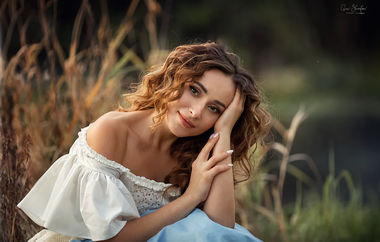 Photo wallpaper grass, look, girl, nature, pose, blouse, brown hair, curls