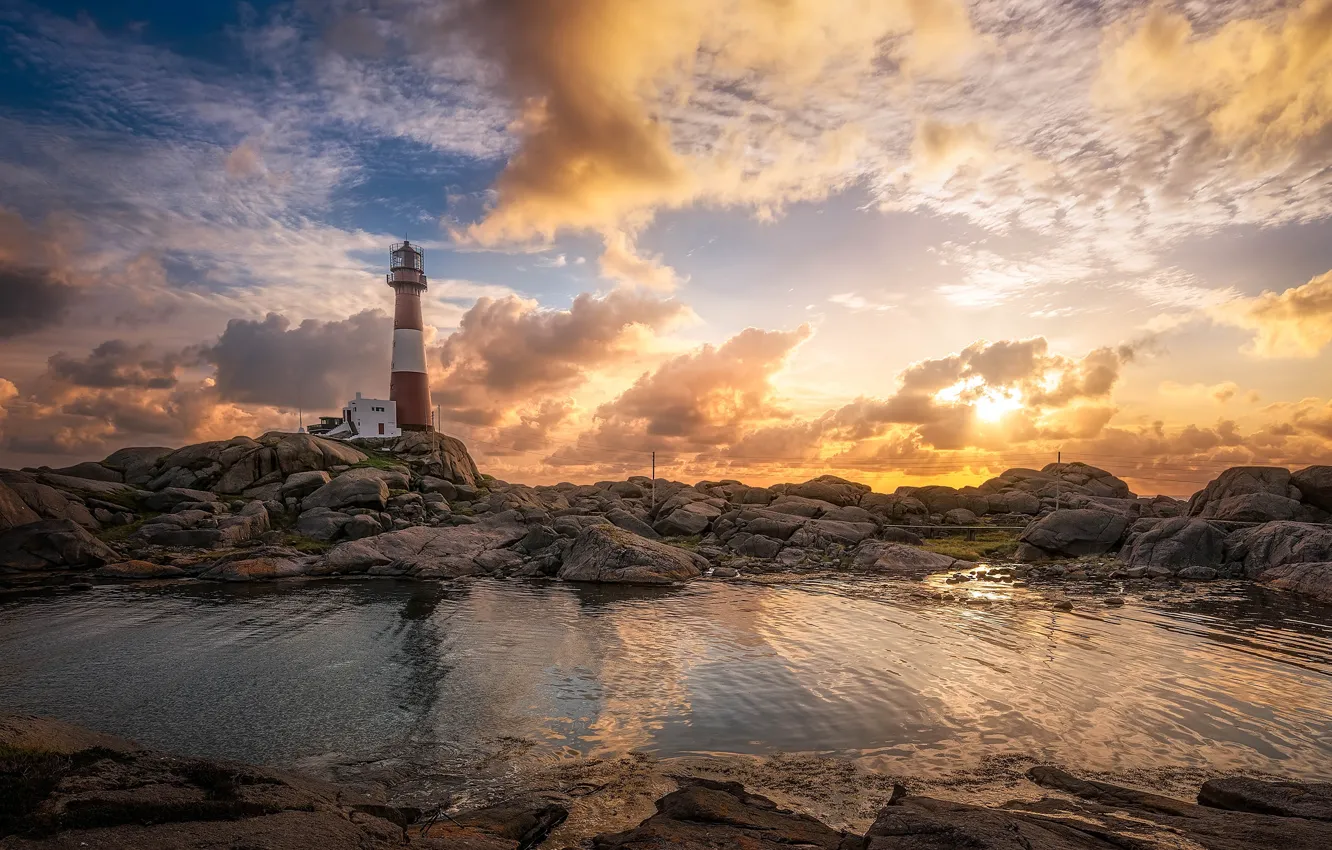 Photo wallpaper sea, the sky, the sun, clouds, stones, dawn, coast, lighthouse