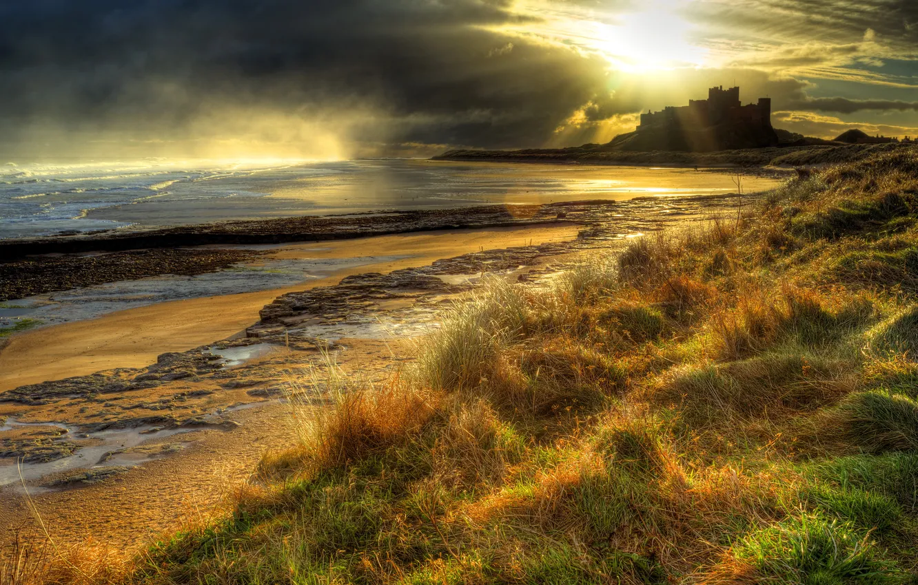 Photo wallpaper sea, the sky, grass, sunset, clouds, stones, castle, coast