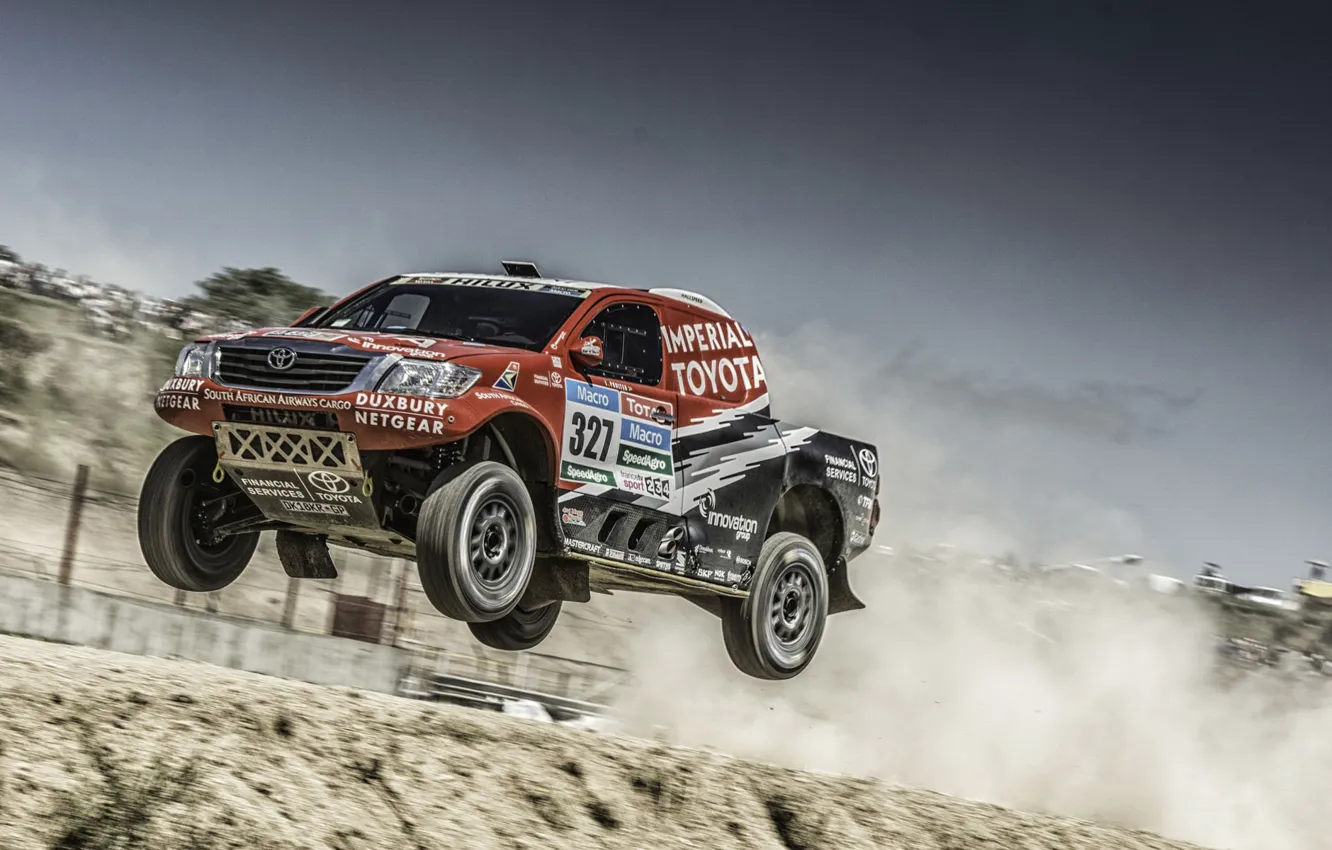 Photo wallpaper car, clouds, jump, desert, dust, Toyota, Hilux, Rally