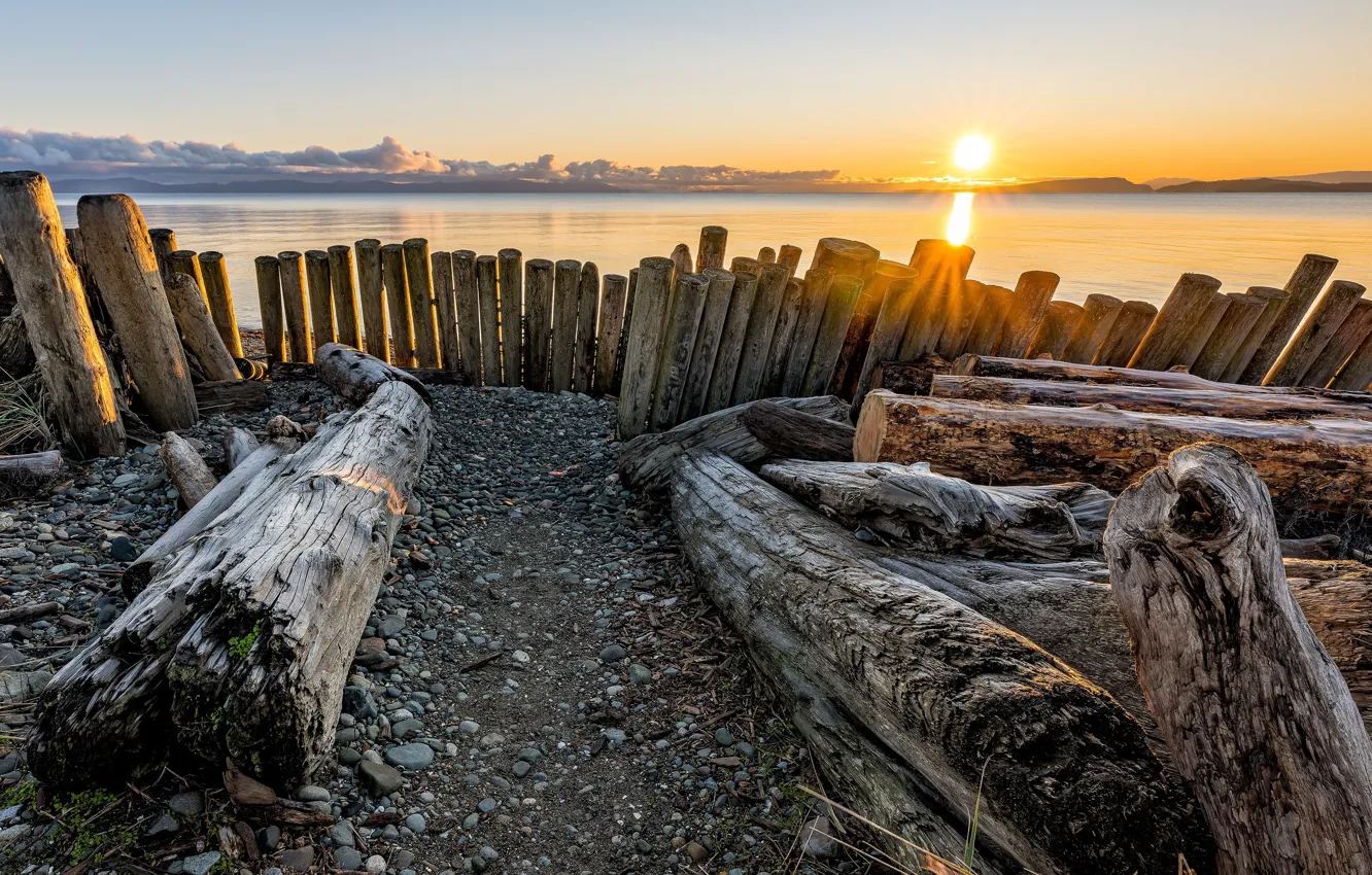 Photo wallpaper the sky, the sun, clouds, rays, light, trees, sunset, pebbles
