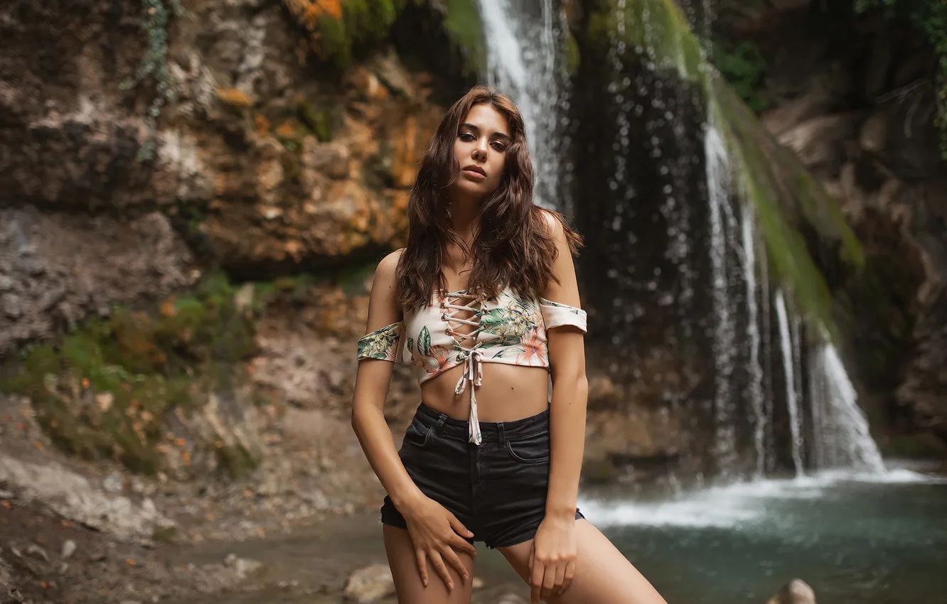 Photo wallpaper girl, nature, water, model, waterfall, brunette, jeans shorts, looking at viewer