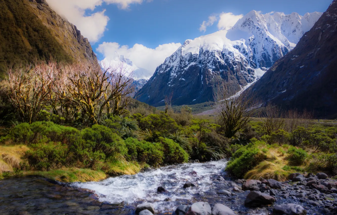 Photo wallpaper the sky, clouds, snow, mountains, river, stones, tops, the bushes