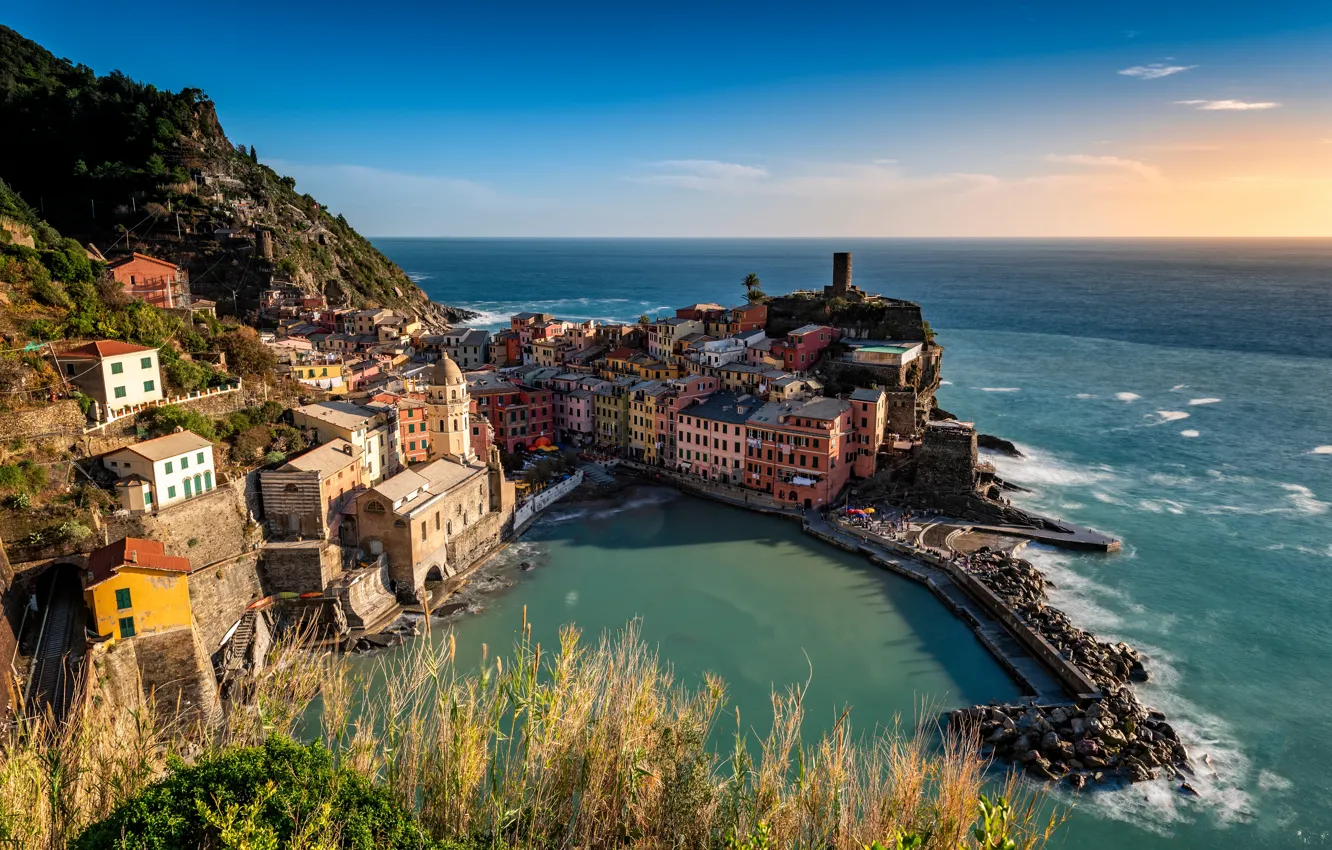 Photo wallpaper sea, the sky, grass, light, mountains, the city, blue, stones