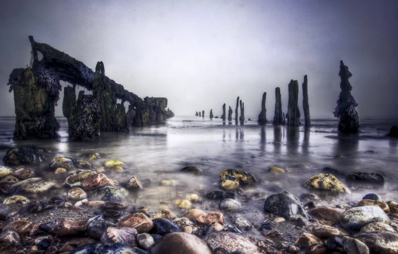 Photo wallpaper sea, stones, posts