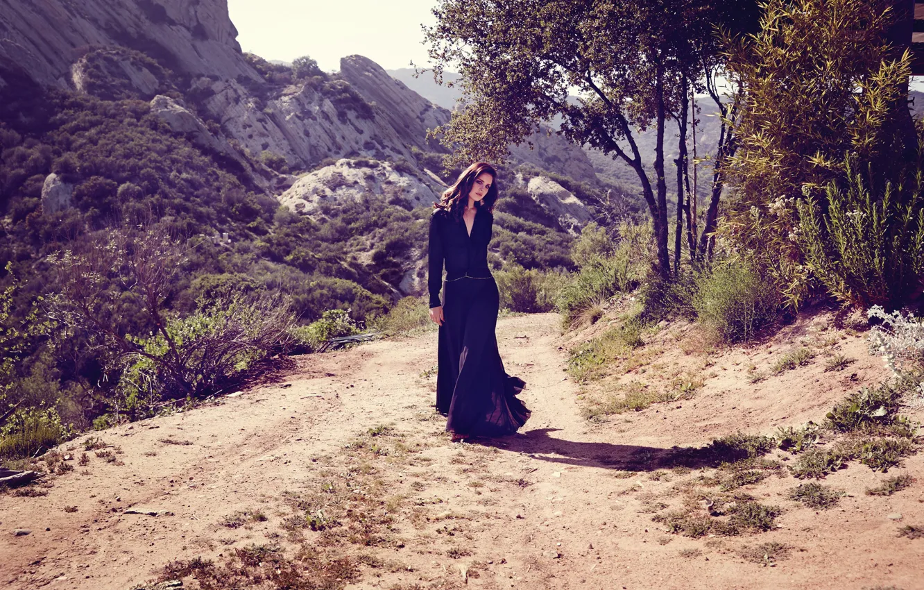 Photo wallpaper road, trees, mountains, stones, valley, figure, dress, brunette