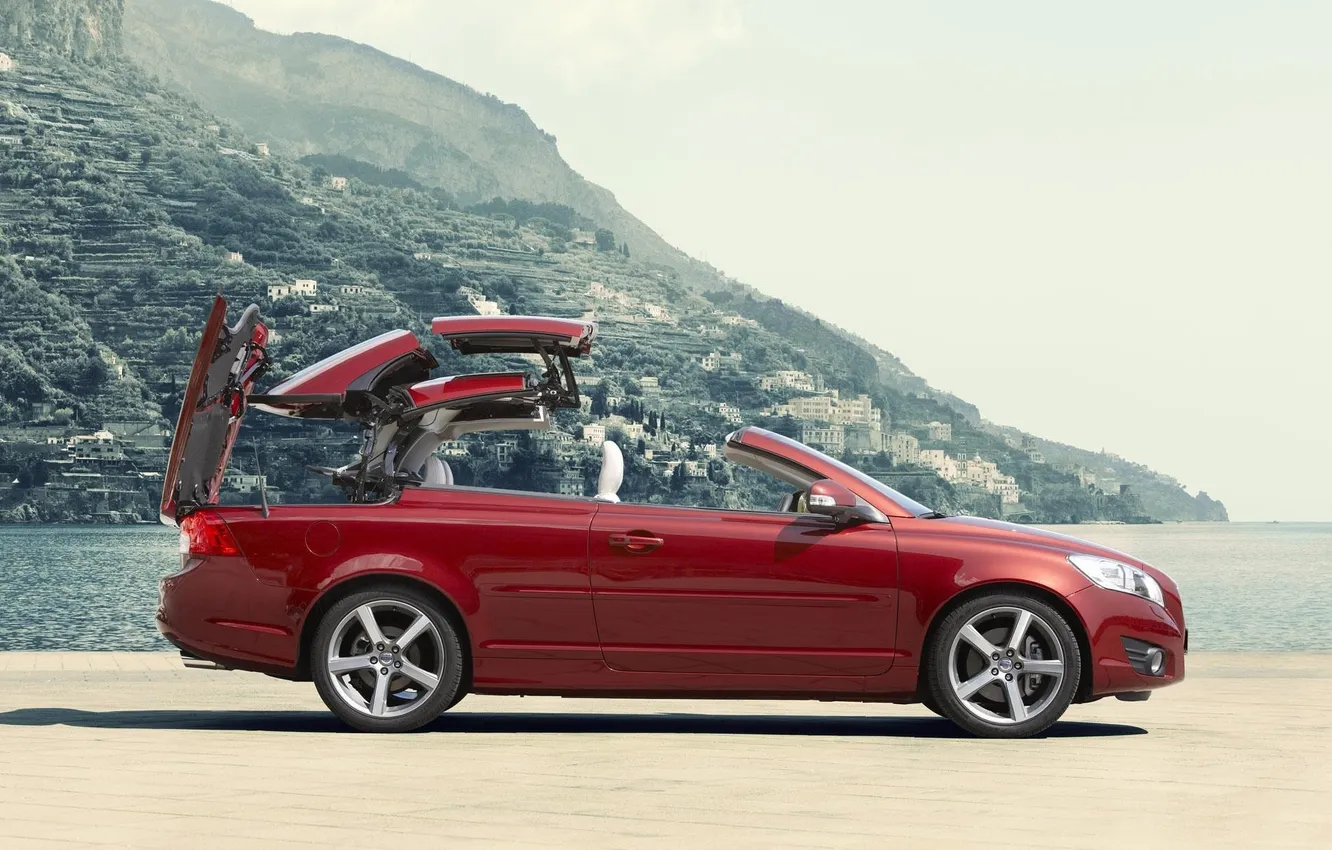 Photo wallpaper roof, water, mountains, the city, convertible, promenade, volvo