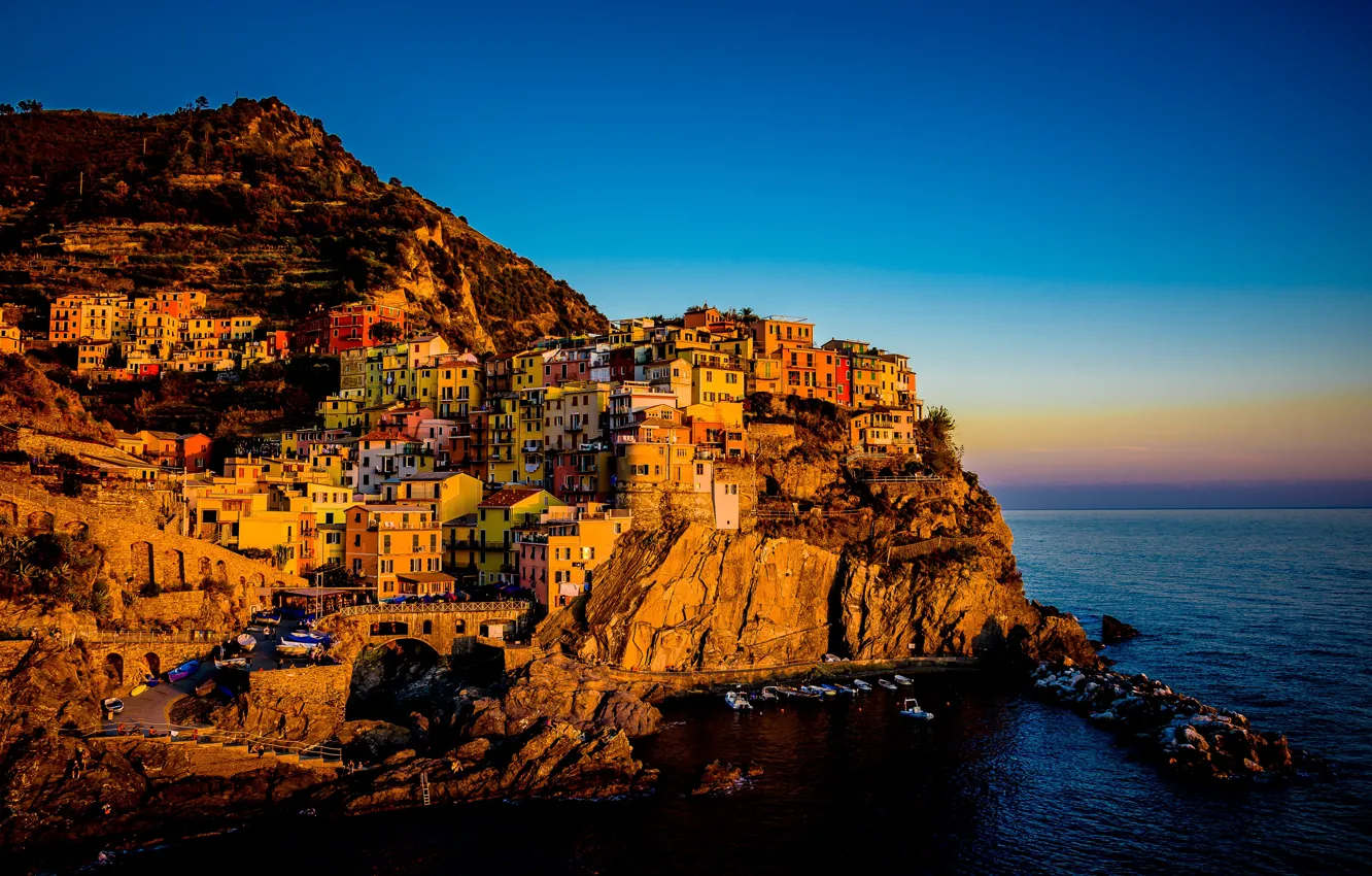 Photo wallpaper sea, the sky, light, mountains, the city, blue, stones, rocks