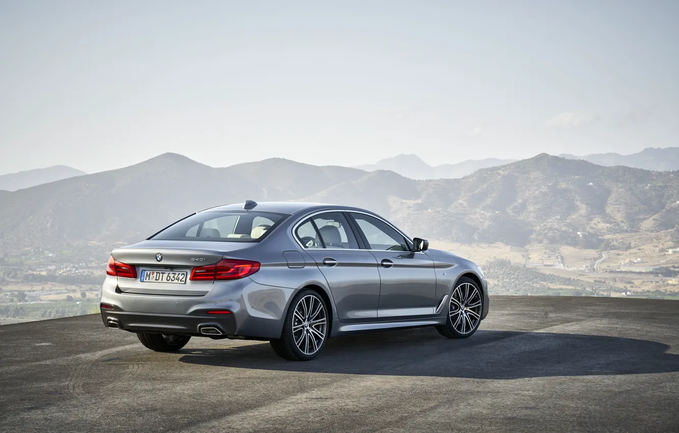 Photo wallpaper the sky, asphalt, mountains, grey, BMW, back, sedan, side view