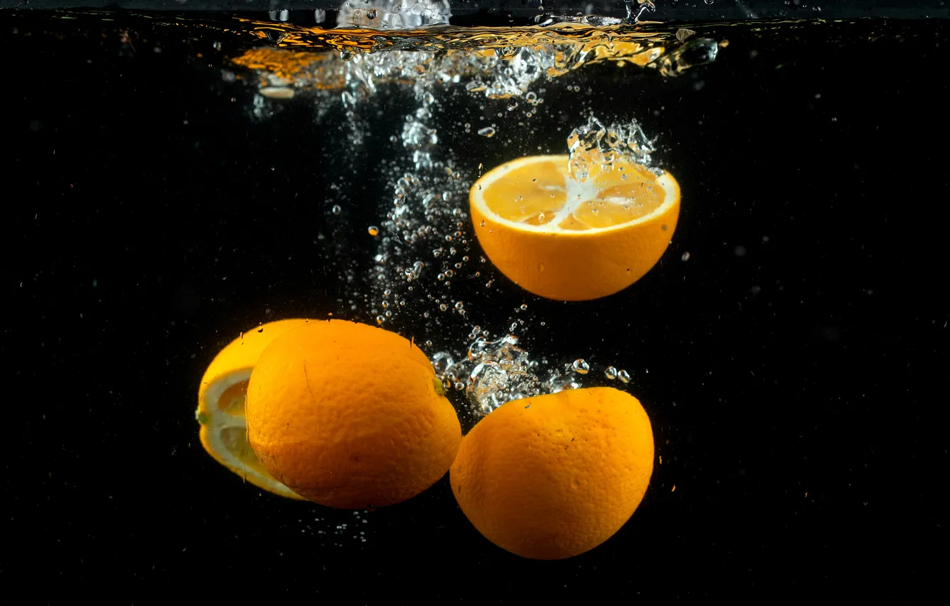 Photo wallpaper water, bubbles, orange, fruit, black background, under water, halves, in the water