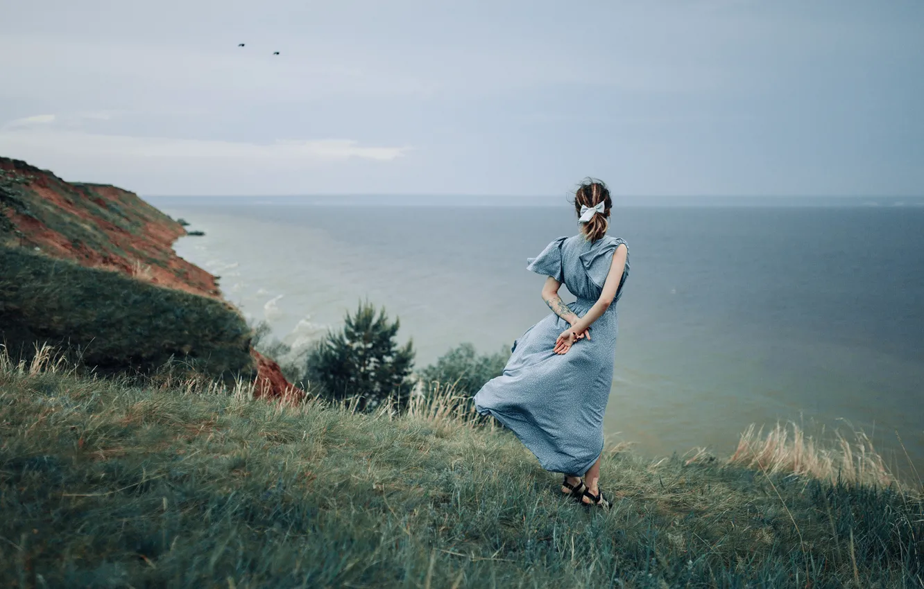Photo wallpaper sea, the sky, grass, girl, mountains, nature, the wind, shore