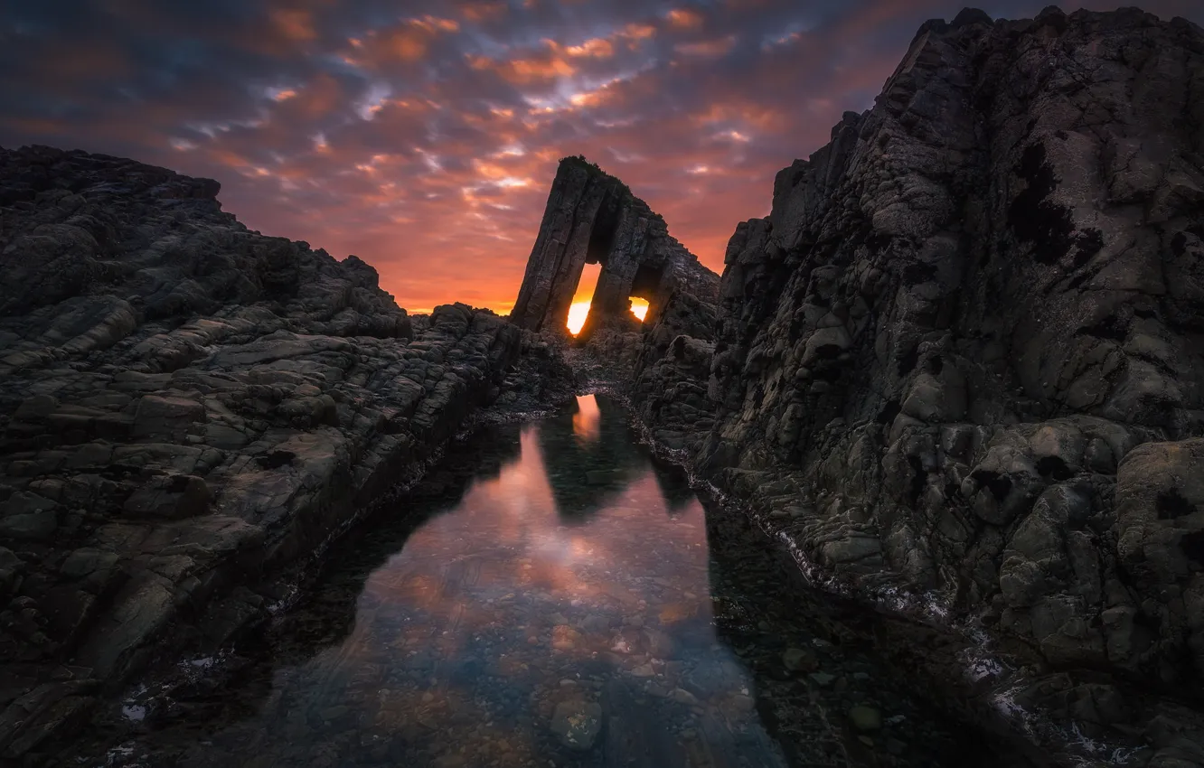 Photo wallpaper sea, clouds, light, sunset, stones, the ocean, rocks, holes