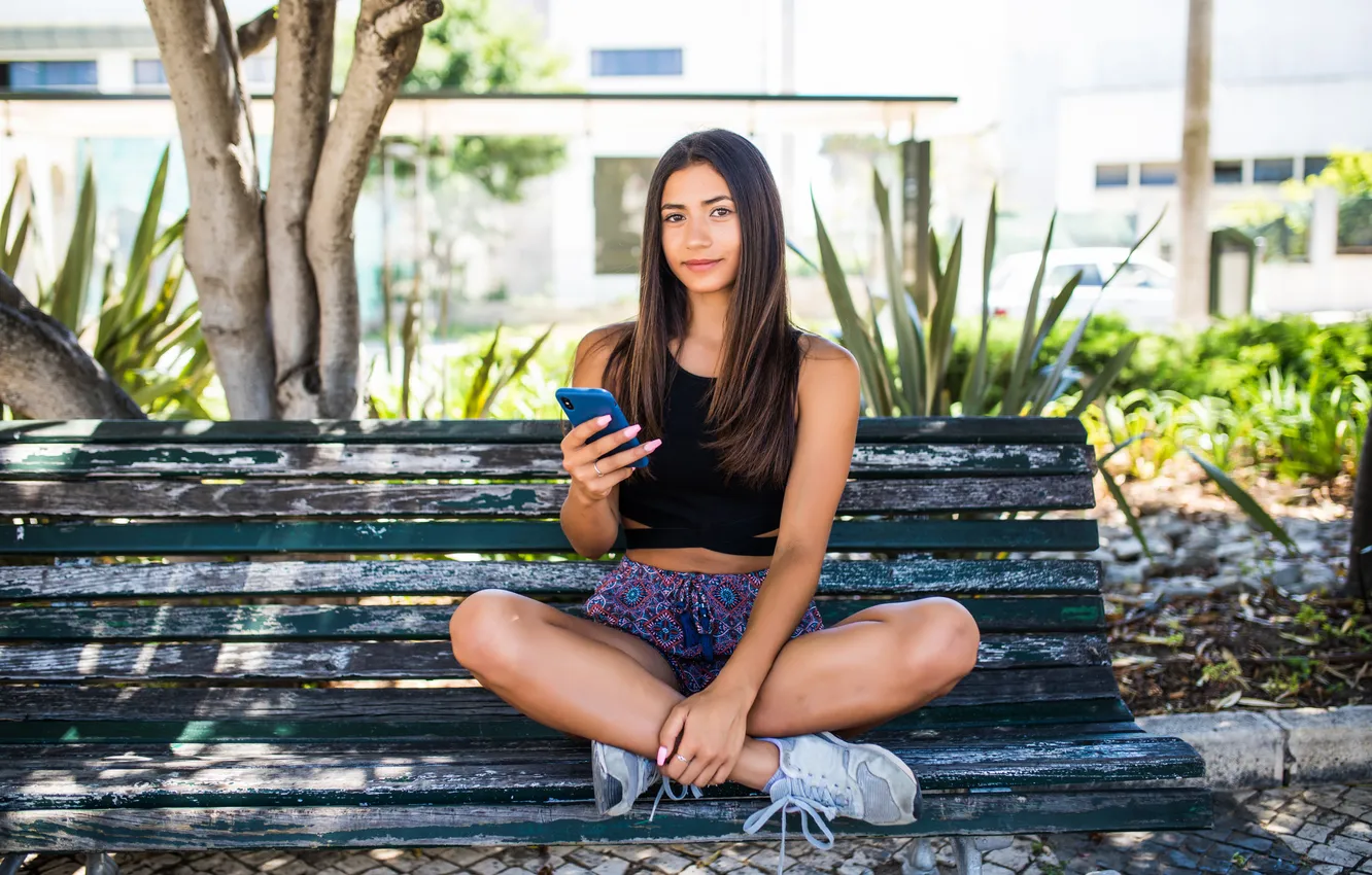 Photo wallpaper woman, young, street, bench, phone, sitting, latin