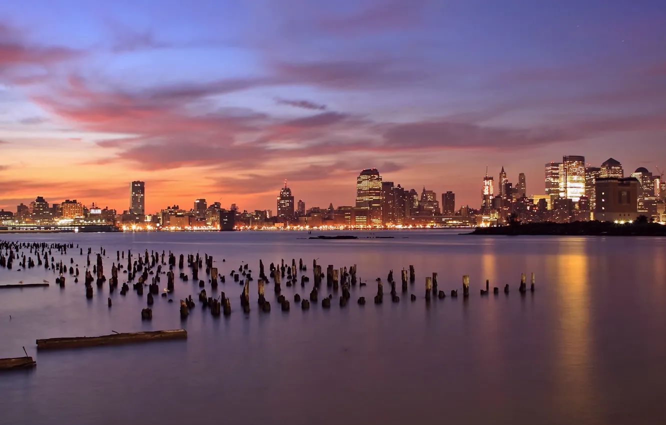 Photo wallpaper the sky, clouds, sunset, orange, lights, river, skyscrapers, the evening