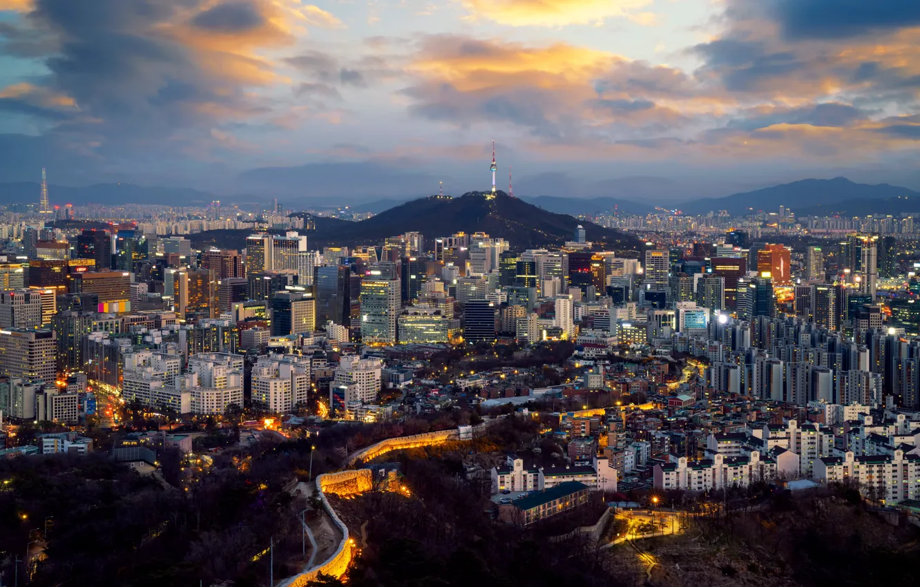 Photo wallpaper clouds, mountains, the city, lights, fog, view, building, tower