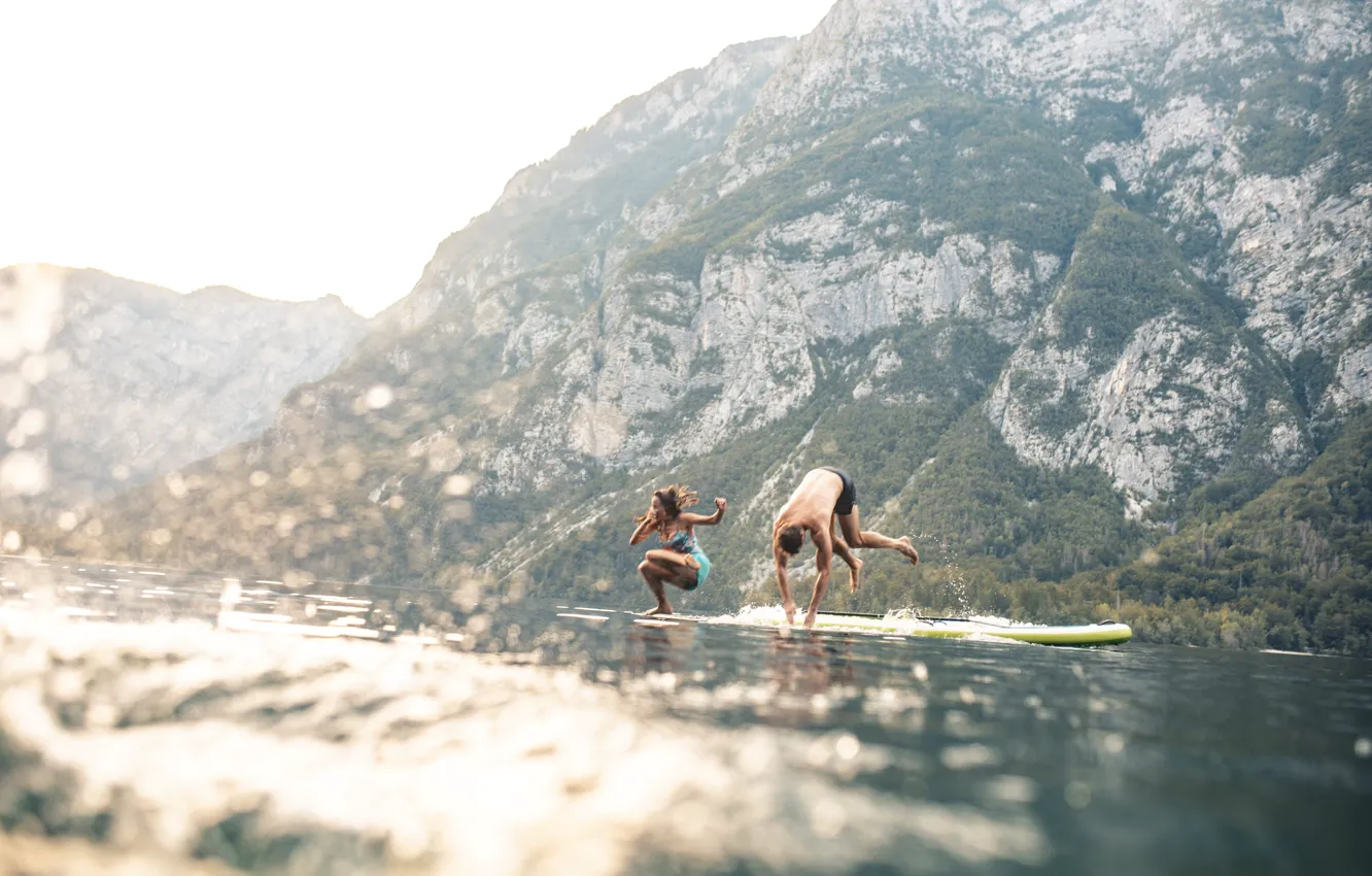 Photo wallpaper Water, Girl, Mountains, Lake, Jump, Guy, Two, Slovenia