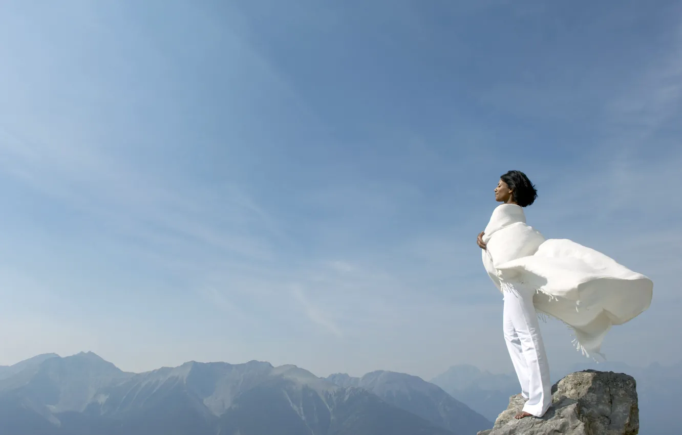Photo wallpaper the sky, girl, mountains, rocks, the wind, top, in white