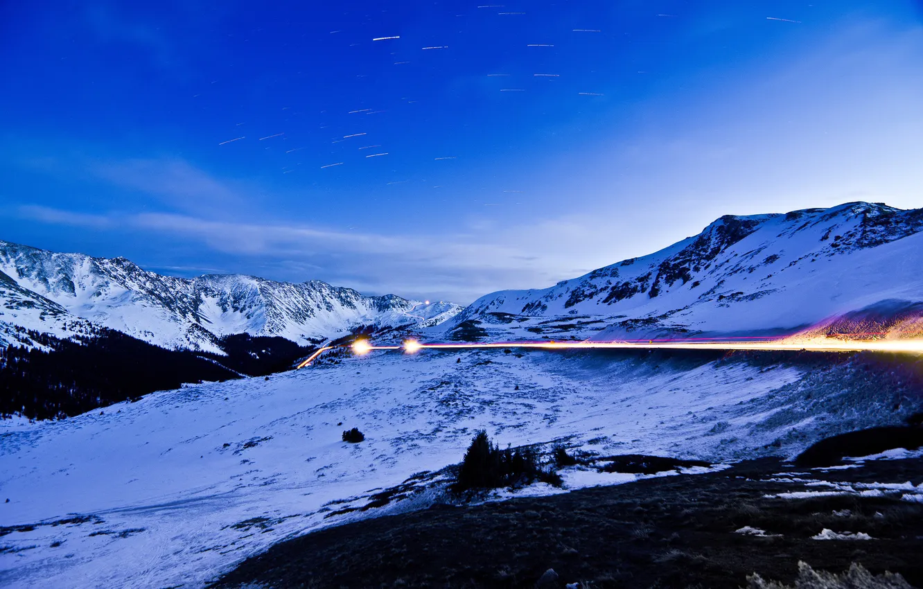 Photo wallpaper road, snow, mountains, lights, twilight