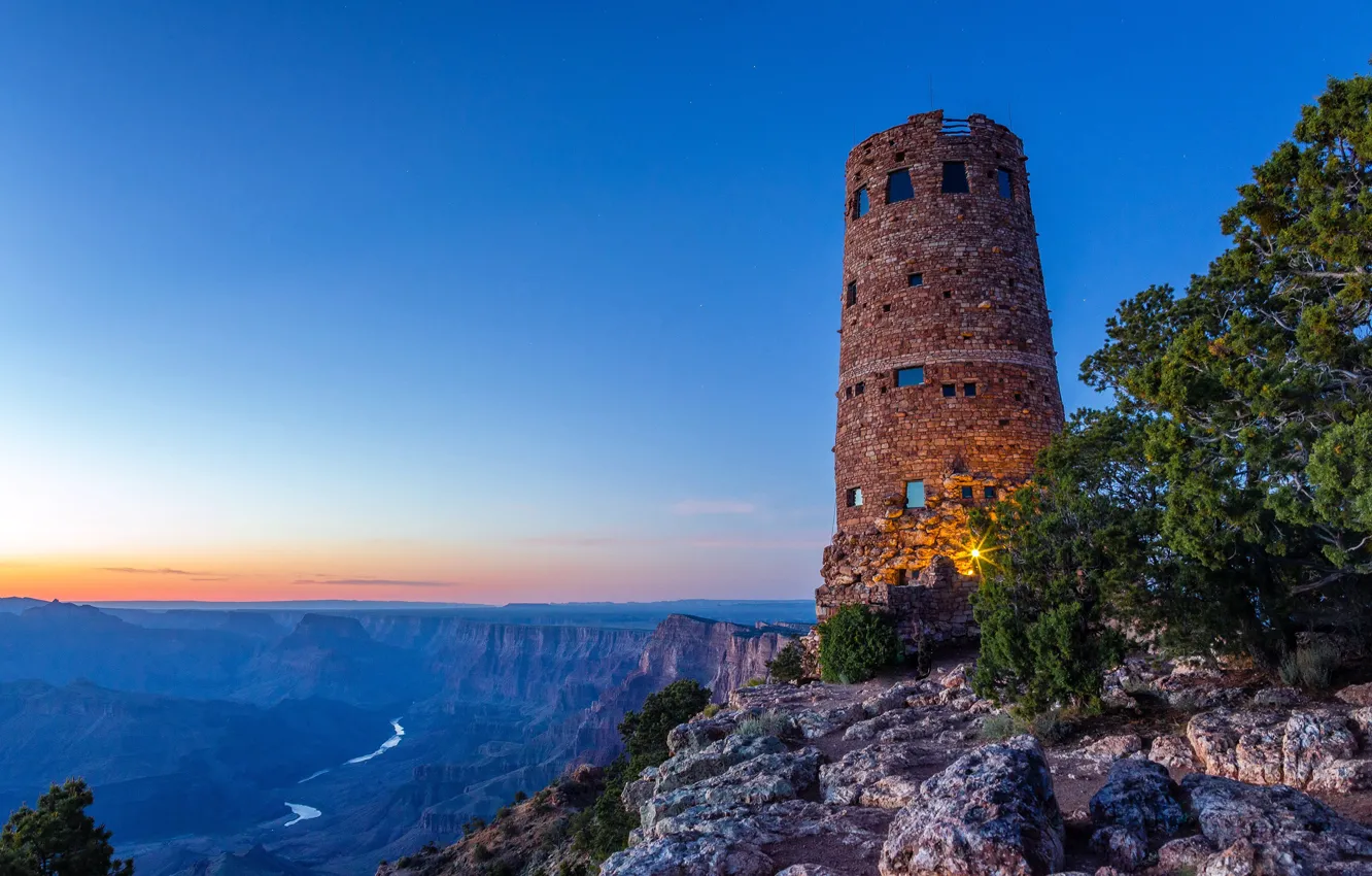 Photo wallpaper the sky, trees, sunset, stones, rocks, tower, horizon, lights