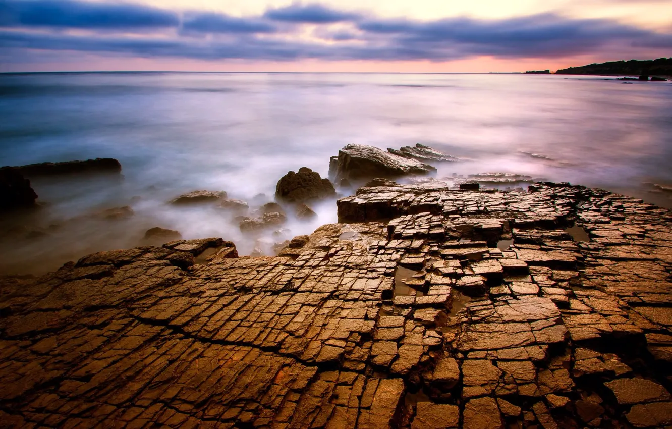 Photo wallpaper sea, surface, clouds, cracked, stones, the evening