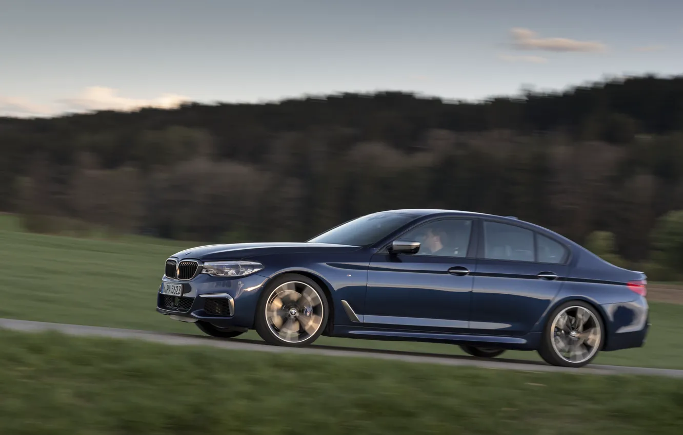 Photo wallpaper road, field, forest, the sky, hills, vegetation, BMW, sedan