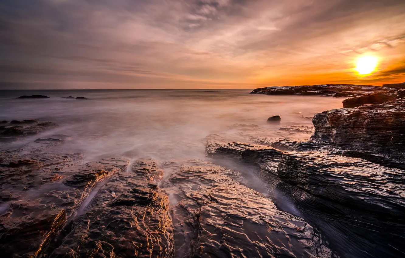 Photo wallpaper sea, the sky, the sun, clouds, sunset, stones, rocks