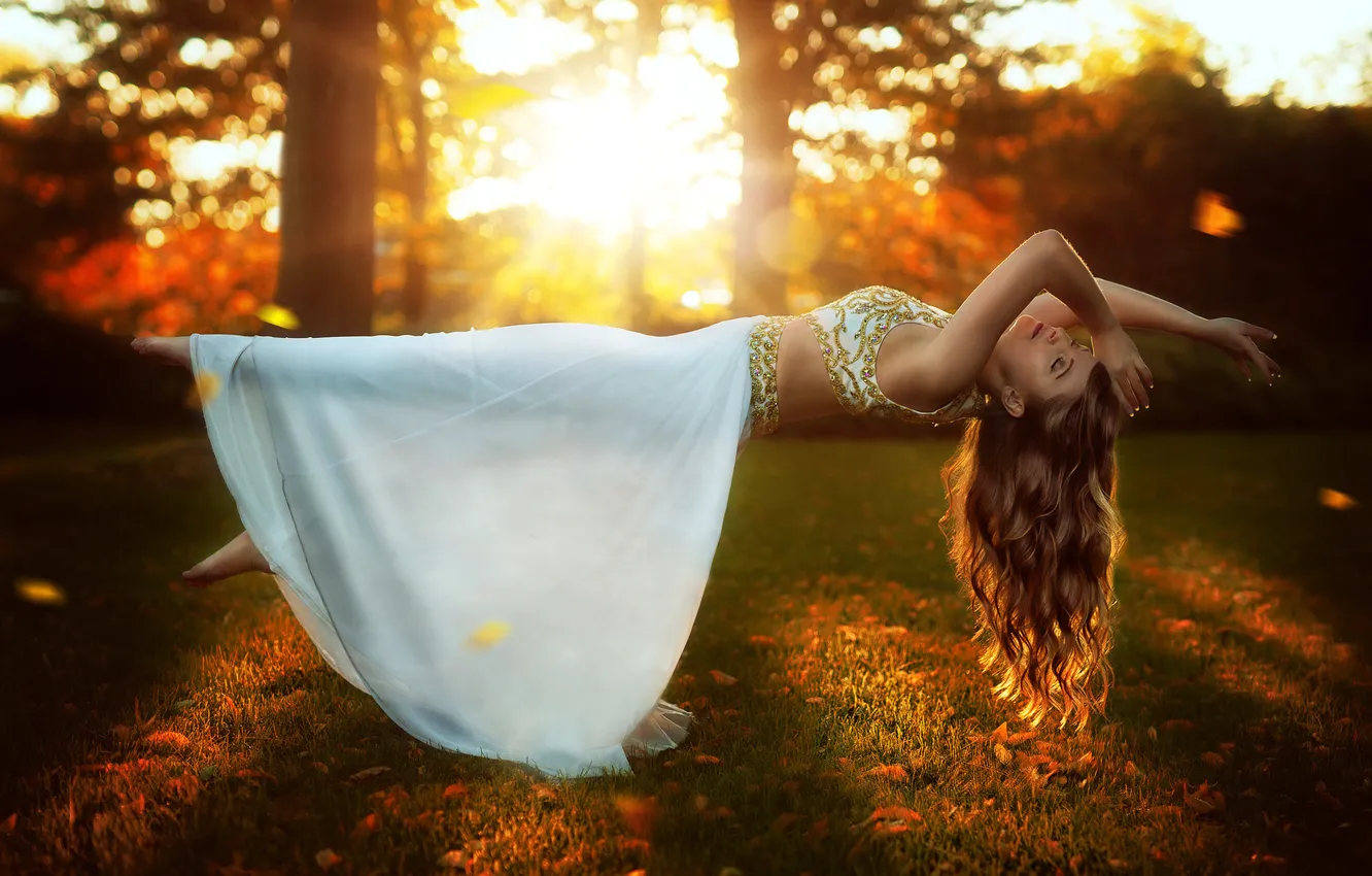 Photo wallpaper autumn, forest, girl, the sun, rays, light, flight, face