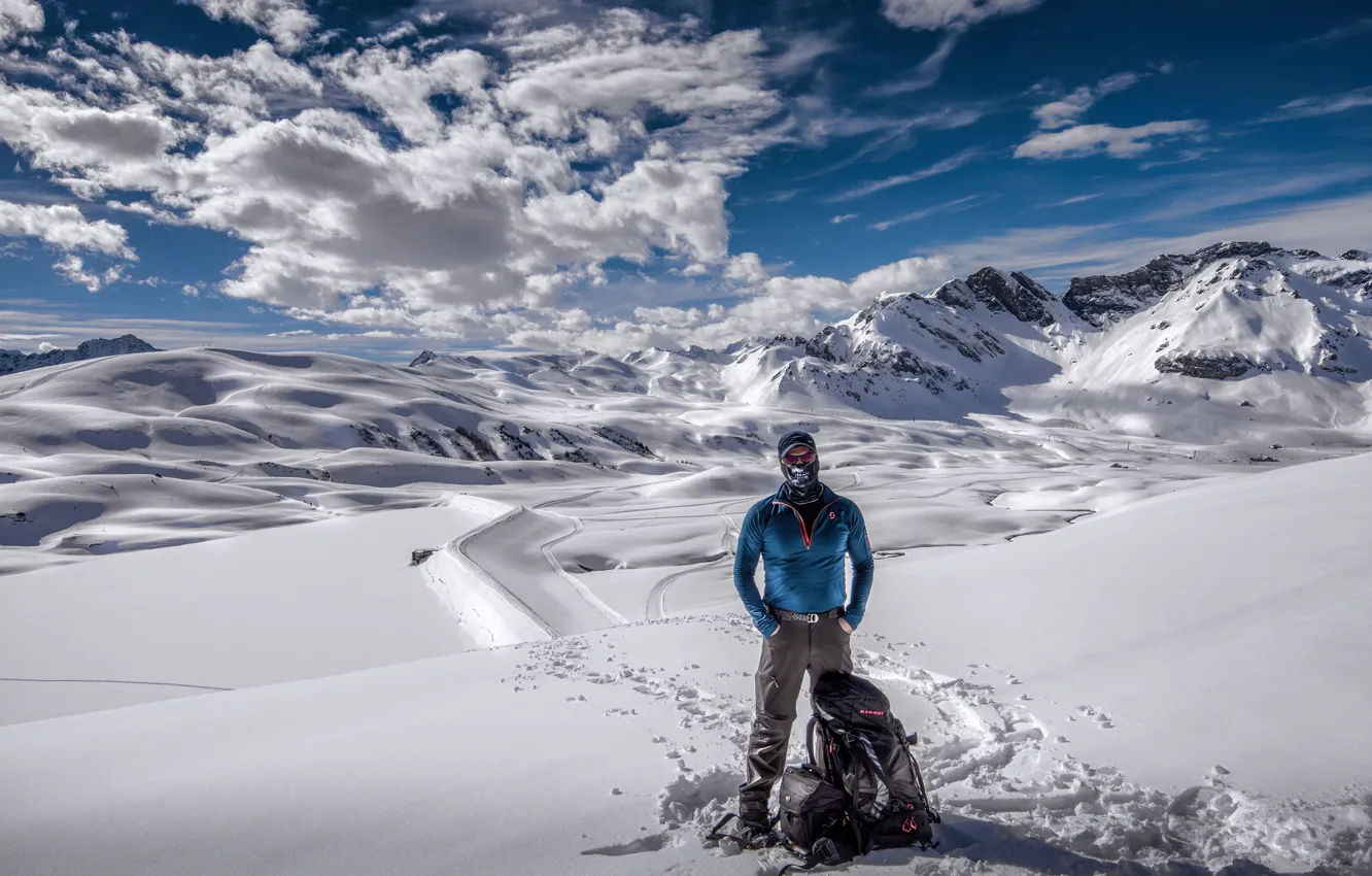 Photo wallpaper winter, clouds, snow, mountains, headband, male, guy, backpack