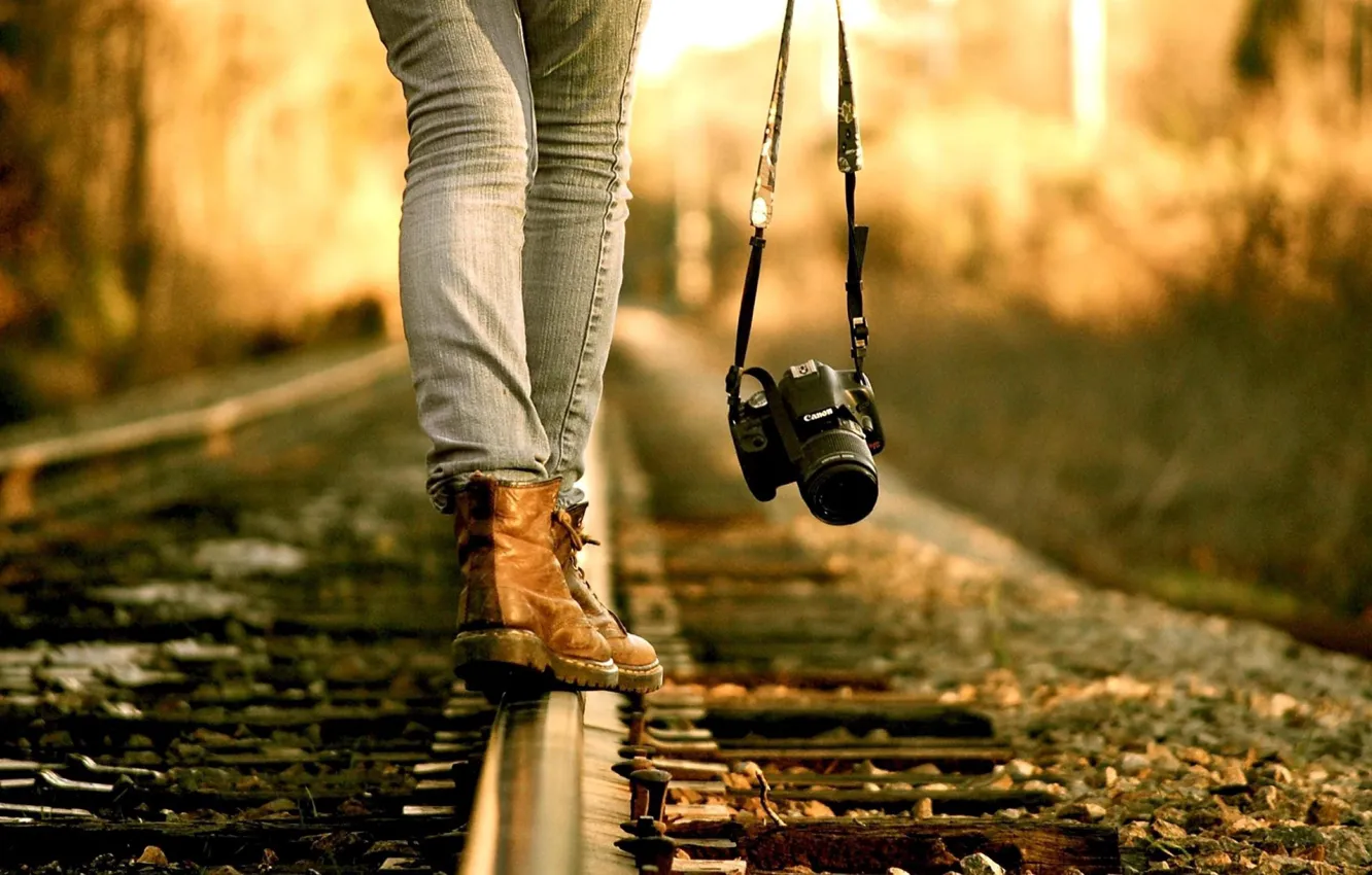 Photo wallpaper autumn, girl, rails, jeans, the camera, railroad, legs, shoes