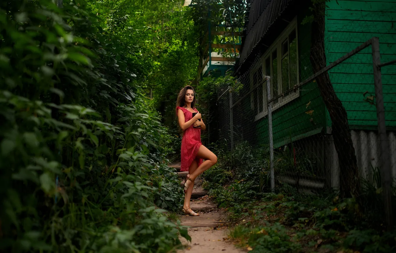 Photo wallpaper girl, legs, nature, model, brunette, plants, cottage, red dress