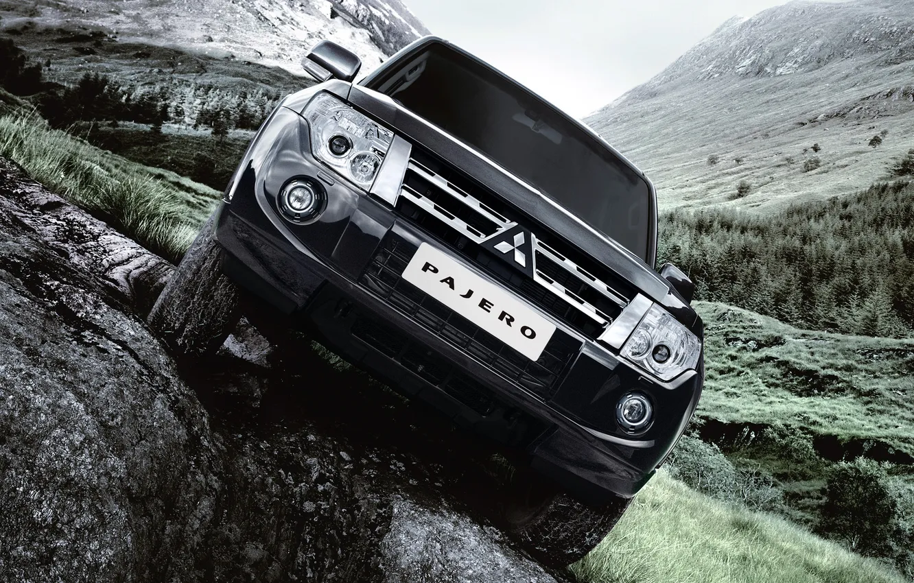 Photo wallpaper grass, mountains, stones, black, mitsubishi, pajero, the front, Mitsubishi