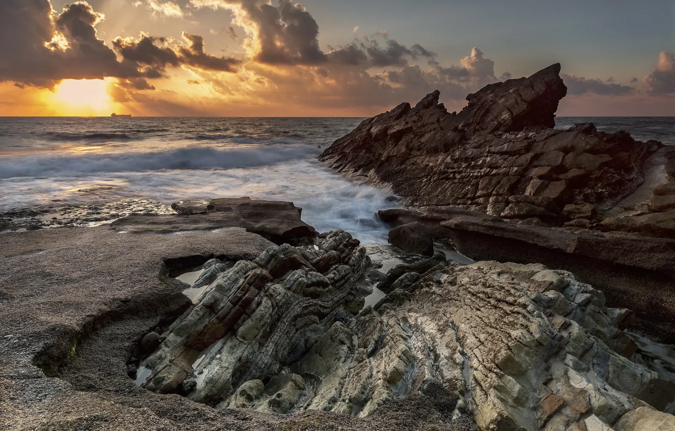 Photo wallpaper sea, wave, the sun, clouds, sunrise, rocks, shore, horizon