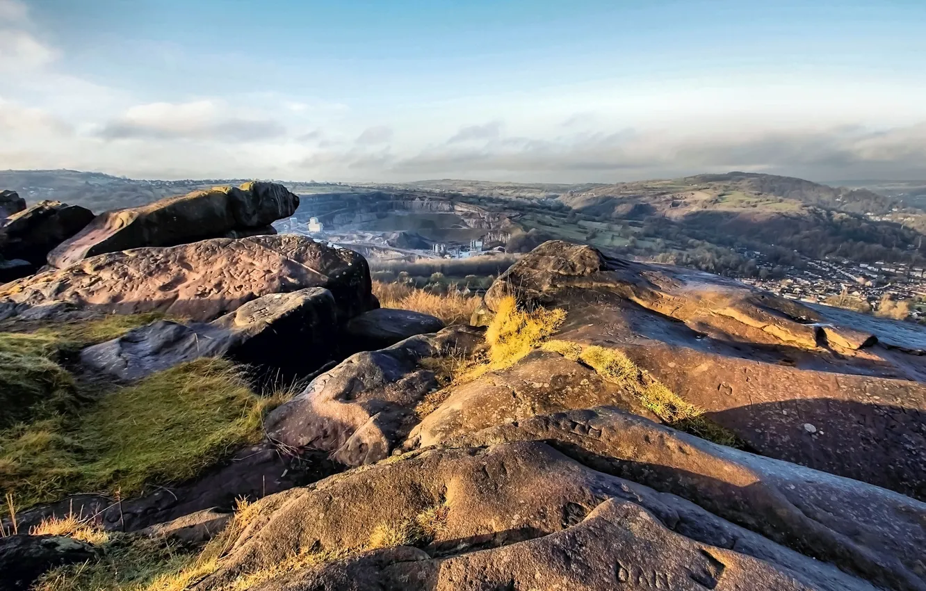 Photo wallpaper mountains, stones, the inscription, figure