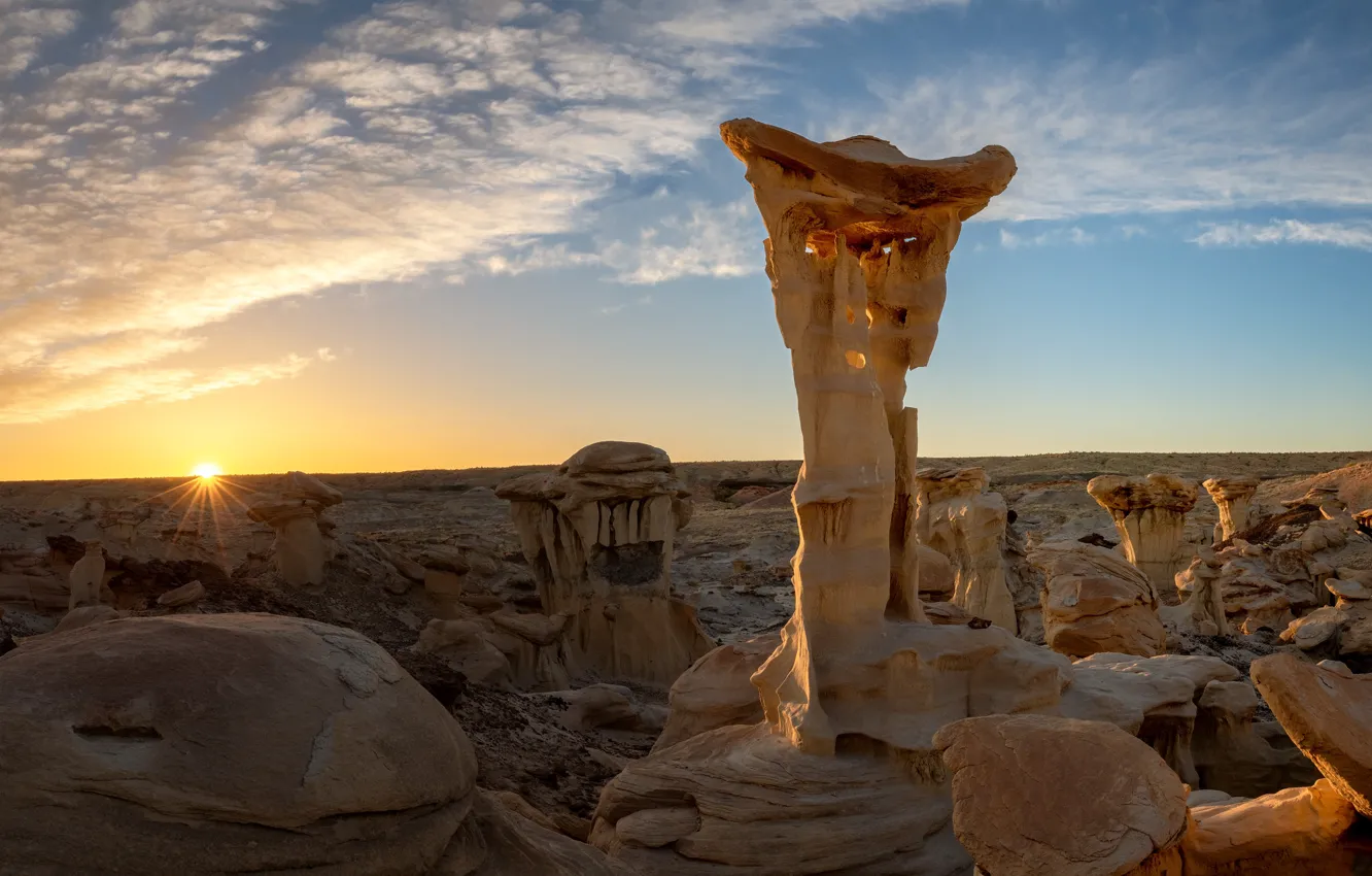 Photo wallpaper the sun, stones, relief, rays, horizon, desert, dawn, the sky