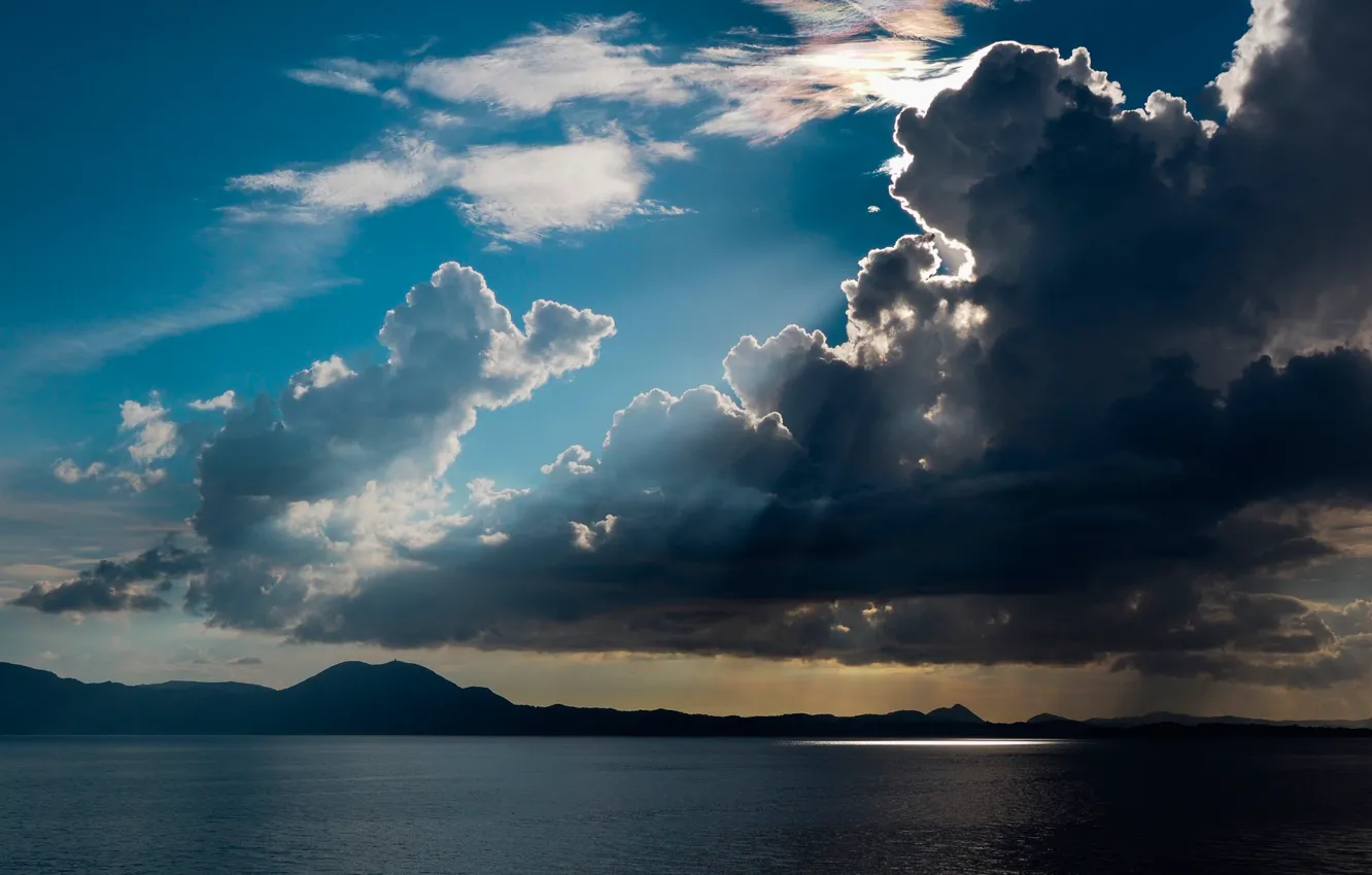 Photo wallpaper clouds, lake, the rays of the sun