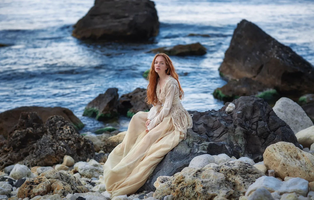 Photo wallpaper sea, look, girl, pose, stones, rocks, coast, dress