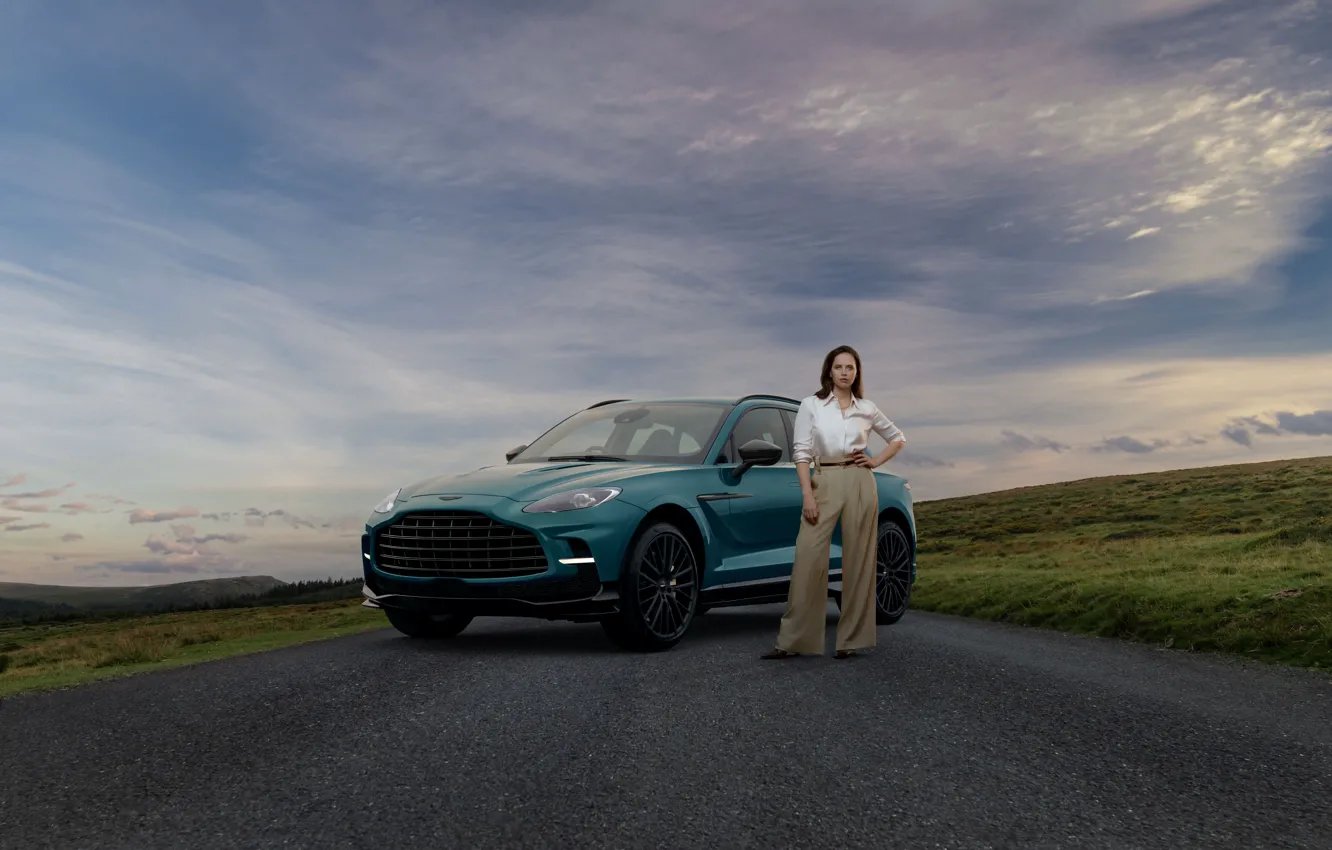 Photo wallpaper Aston Martin, Clouds, Girl, Road, Aston Martin, SUV, SUV, Felicity Jones