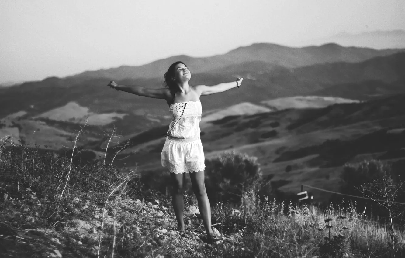 Photo wallpaper girl, mountains, smile, the wind, feet, hair, valley, white dress