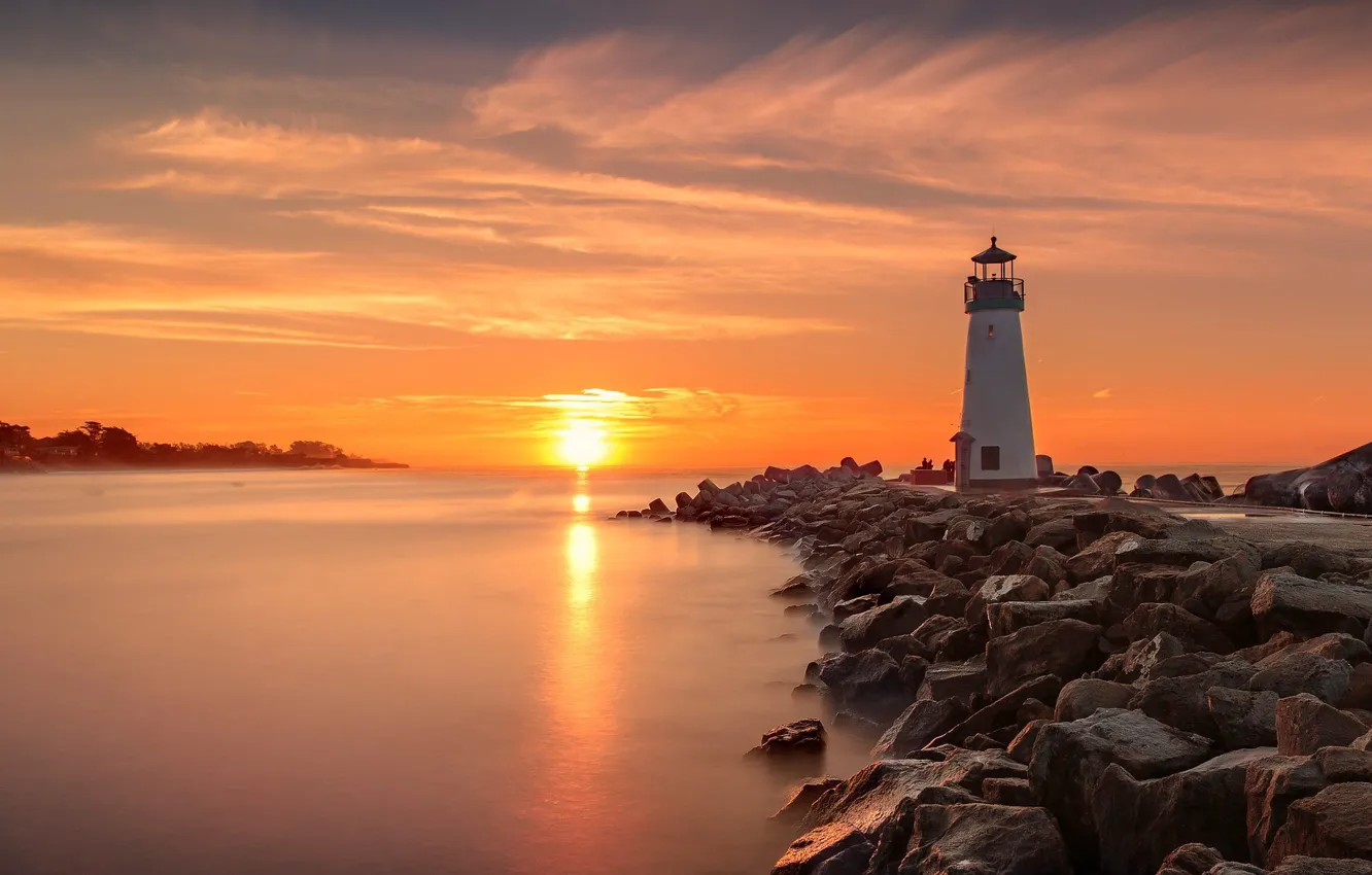 Photo wallpaper sea, the sun, clouds, sunset, stones, shore, lighthouse, the evening