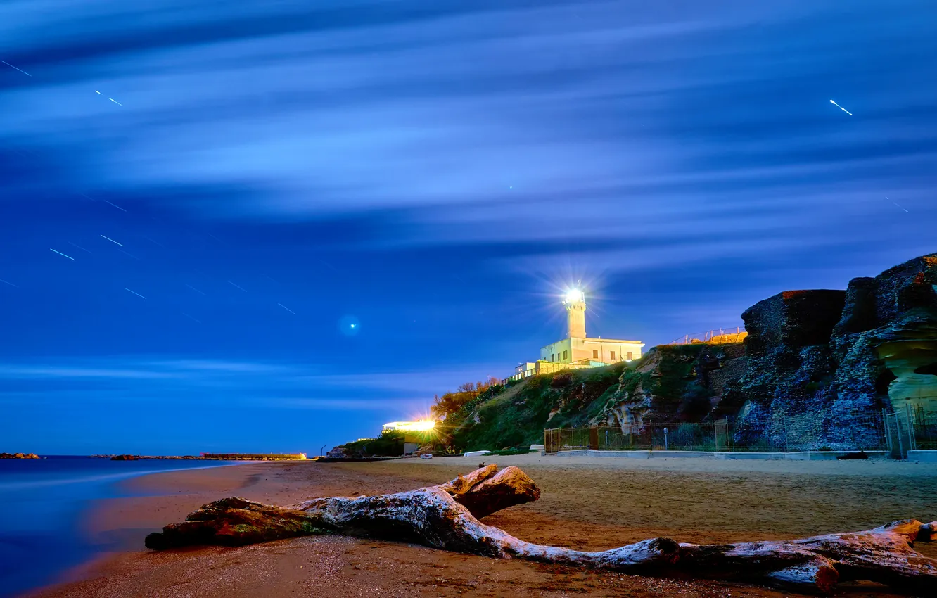 Photo wallpaper sand, sea, rays, light, shore, coast, lighthouse, the evening