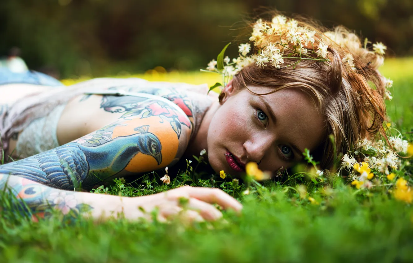 Photo wallpaper grass, look, girl, flowers, face, tattoo, wreath, bokeh