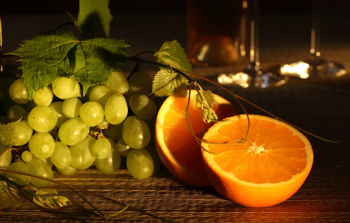 Photo wallpaper leaves, table, oranges, grapes, twilight, bokeh