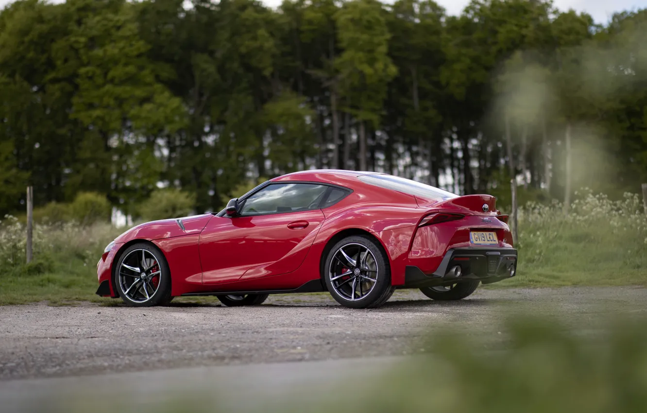 Photo wallpaper asphalt, trees, red, coupe, Toyota, side view, Supra, the fifth generation