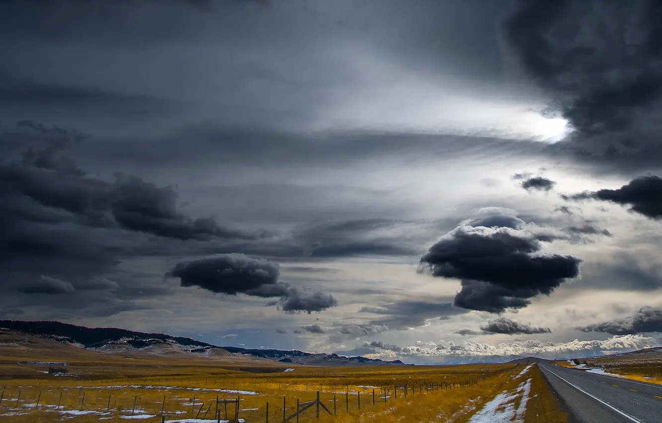 Photo wallpaper road, field, the fence, storm, gray clouds