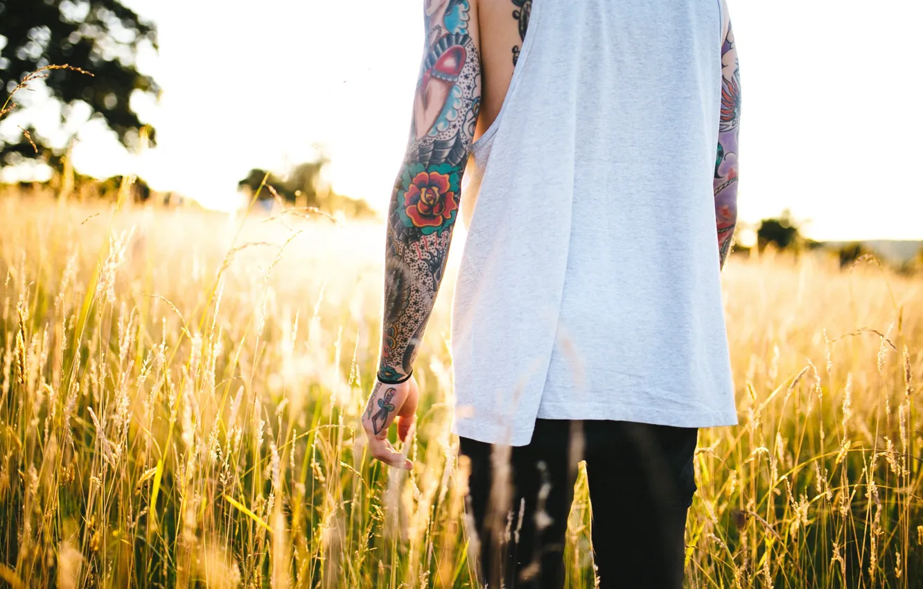 Photo wallpaper field, grass, light, tattoo, male, guy, tattoo
